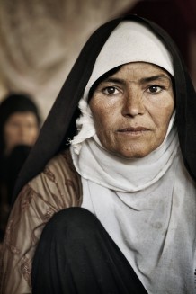 Fatema, 40 years old.  “In Afghanistan parents settle their daughters’ future. I am one of those daughters. My father forced me to marry an old man, who is now 90 and has become mad". Herat Province, Afghanistan, 2011.