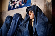 Bibi Gul is completely deaf in her right ear, she only has partial hearing on her left side. Fear framed her every move, she strained to read peoples lips to gain an understanding of her fait. She carried an inner-panic to see her test results. For most Afghans a TB positive result still means a death sentence. She has gotten used to the beatings that rendered her deaf, but she is not willing to let go of life.<br> TB Centre, OPD (outpatient department). Herat, 2012