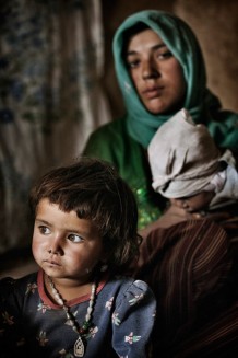 Kobra, 3, in the background her great aunt Nasima, who does not know her age. Zia Gul, Kobra’s mother, says: “I am very depressed. I have three children, my husband injured his hand and can’t work anymore, I am unemployed too. Kobra is a very quiet child and at least, thanks to GVC, she will be drinking safe water”. 2011