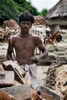 Construction of Akbar's (one of Cesvi's beneficiaries) shelter at Enginee Ramzan. Sindh, Pakistan, 2013