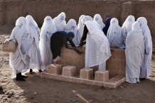 New water access point at the rehabilitated maternity ward. Trained midwives promoting hands hygiene to a girl. Hamashkoreeb, Kassala State. Sudan 2015