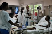 Surgical and Paediatric Centre, intensive care room. Haja Rabia, 73 years old, is recovering from hip surgery. Goderich, Freetown, Sierra Leone 2017