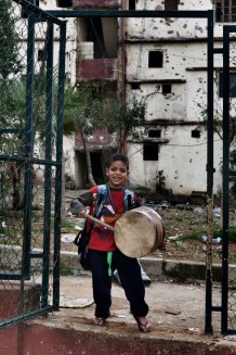 Children playing in Tebenneh, stronghold of Sunni Muslims. Destruction and poverty are consequences of recurring fightings with Alawites of Jabal Mohsen or with the Libanese army. Tripoli, Lebanon, 2014