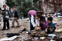 Children playing in Jabal (Mountain) Mohsen, stronghold of Alawite Muslims. Destruction and poverty are consequences of recurring fightings with Sunnis of Tebenneh. Tripoli, Lebanon 2014