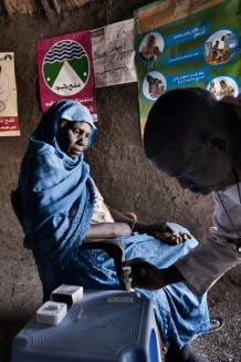 Bahria Alsadig, 37 years old, during her malaria test done by community health worker Saifeldin Abdalrahman Abdalkareem. Eventually the test was negative. Marin village, Rahad locality, Gedaref State. Sudan 2015