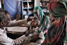 Medical assistant Ahmed Hassan Ahmed, 51 years old, visiting Ibrahim Gomaa, 4 years old, sick with anaemia. Ardalhager health centre, Girba locality, Kassala State. Sudan 2015