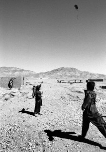 Karizak, IDP (internally displaced persons) camp, one of the first kites of the season. In the background, the Paediatric Hospital, 2010