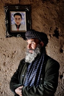 There is always hope when you meet men like Hemat (courage), his name has been changed to protect his identity. When they returned from Iran, he felt very weak and coughed all day. He self diagnosed himself as missing his son who he had left behind. "I can't put into words how depressed, worried and ashamed I was." But after weeks of his persistent cough, he found the courage to run down to the van with the visiting doctors. The strangers convinced him he needed to come to the clinic for the sputum and X ray test. He was diagnosed with TB. He had heard that it was a death sentence. The thought of never seeing his beloved son again, broke his heart. He decided to follow the doctors’ orders and finish the long regimen of exams and medicines. Today, as the leader of his camp, he is the number one recruiter to bring the kids and neighbours to the doctors to get examined." I decided this is my mission now, to get everybody tested and advocate for health in my community." Many in his clan have been saved.<br>Maslakh, IDP (internally displaced persons) camp. In the photo, his son refugee in Iran. Province of Herat, 2012