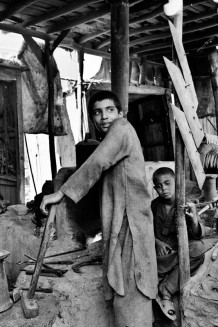 Blacksmiths. Pul-i-Khumri, Afghanistan, 2003.  In Afghanistan, as registered by UNICEF in 2004, 45% of boys and 60% of girls do not go to school.