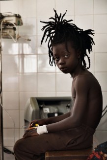 Paediatric Centre, where 150 children are visited every day, emergency room. Michael, 9 years old, is lethargic and can’t keep food down. His mother died one year ago. Goderich, Freetown, Sierra Leone 2017