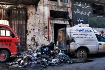 Tebenneh, stronghold of Sunni Muslims. The black flag belongs to ISIS. Destruction and poverty are consequences of recurring fightings with Alawites of Jabal Mohsen or with the Libanese army. Tripoli, Lebanon, 2014