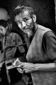 A shopkeeper and his shop-boy. Pul-i-Khumri, Afghanistan, 2003.