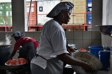 Surgical and Paediatric Centre, kitchen. The cooks prepare all the meals for patients, hospitalized children’s mothers and the staff. In the background some of the hospital containers. Goderich, Freetown, Sierra Leone 2017