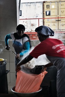 Surgical and Paediatric Centre, kitchen. The cooks prepare all the meals for patients, hospitalized children’s mothers and the staff. In the background some of the hospital containers. Goderich, Freetown, Sierra Leone 2017