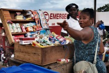 Mariama manages to support herself and her 4 children selling cigarettes, candies, powdered milk, snacks and cooked meals outside of the Surgical and Paediatric Centre. Goderich, Freetown, Sierra Leone 2017