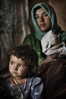 Kobra, 3, in the background her great aunt Nasima, who does not know her age. Zia Gul, Kobra’s mother, says: “I am very depressed. I have three children, my husband injured his hand and can’t work anymore, I am unemployed too. Kobra is a very quiet child and at least, thanks to GVC, she will be drinking safe water”. 2011