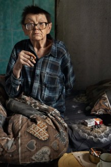 Eugeniy, 75, beneficiary. Eugeniy has been disabled for over 10 years. He lives bedridden in the bathroom at home. A widower with no children, he has only one relative of his wife who helps him. He doesn't want to leave his home. Berestove, Kharkiv Region. Ukraine, 2026