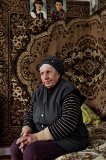 Alla, 72, a displaced person and a beneficiary, during a home visit. She lived in Konstantinovka, a city in the Donetsk Region, in an apartment she loved and had just finished paying for after many years of working in a glass factory. Her city had been occupied by the Russians and retaken by the Ukrainians during the Donbass War, then heavily bombed in the Russo-Ukrainian War. Alla lost her apartment and one son (due to health reasons). Blyzniuky, Kharkiv Region. Ukraine, 2026